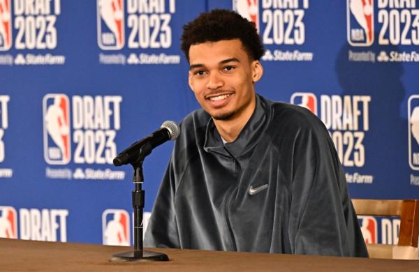 the expected No. pick in the NBA draft, is all smiles at a press co<em></em>nference on June 21.