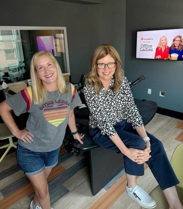 Angela Kinsey and Jenna Fischer smiling. 