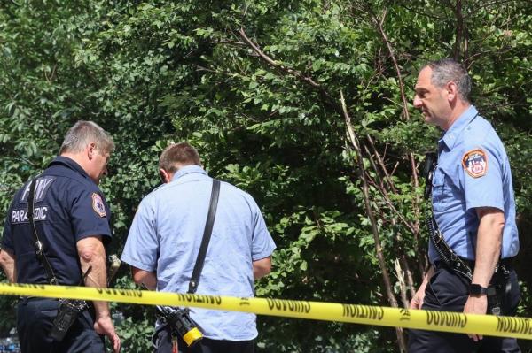 Police are seen investigating the scene wher<em></em>e an elderly man jumped to his death Thursday.