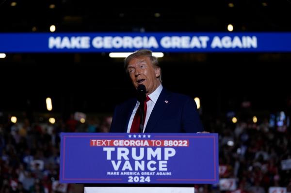 Former President Do<em></em>nald Trump speaking at a 2024 election campaign rally in McCamish Pavilion, Atlanta, Ga.