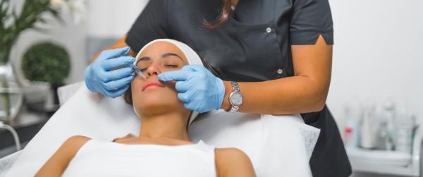 woman receiving botox on her face