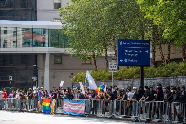 Supporters of gender transition care for minors gather outside of Boston Children's Hospital.