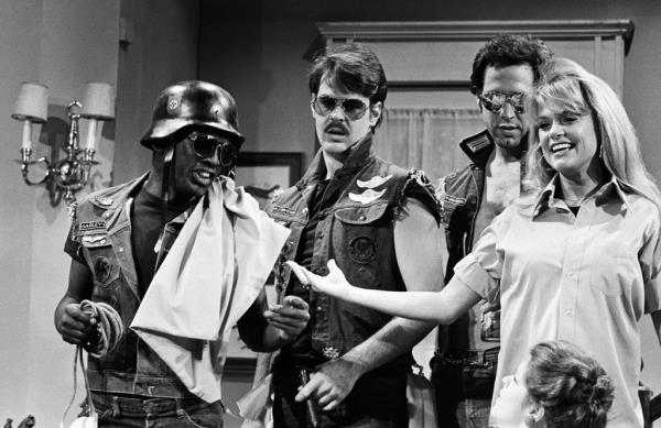 (l-r) Garrett Morris as Hell's Angel, Dan Aykroyd as Hell's Angel, Chevy Chase as Hell's Angel and Dyan Cannon as Daughter during the 