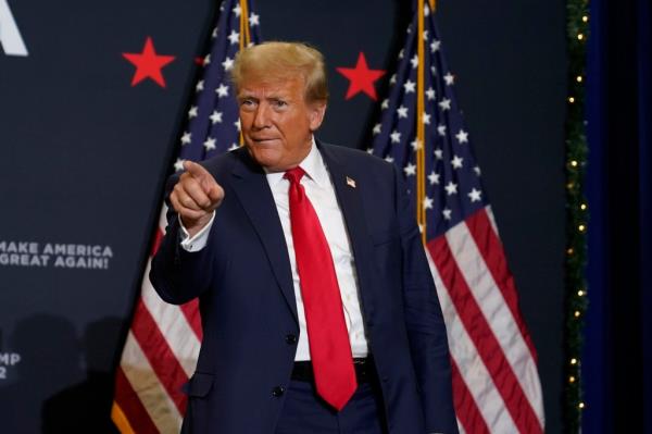 Former President Do<em></em>nald Trump greets supporters as he arrives at a commit to caucus rally, Tuesday, Dec. 19, 2023,