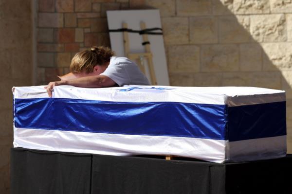 Marciano's mom crying over her coffin. 