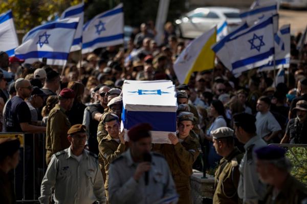 Soldiers carry Marciano's casket through the streets. 