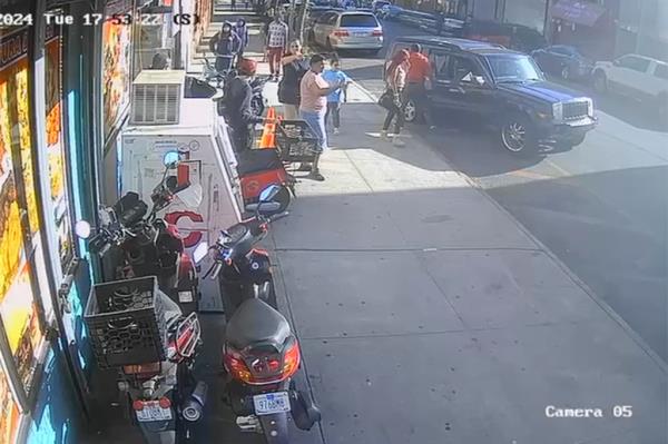 People surround the Jeep.