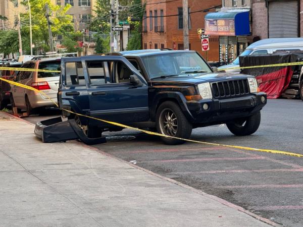 The trashed blue Jeep.