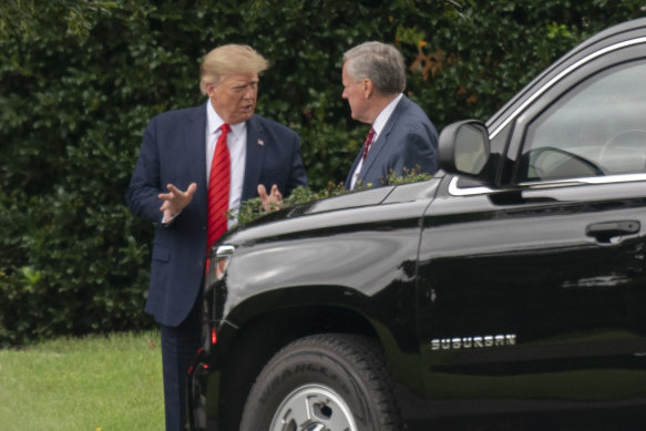 Then US president Do<em></em>nald Trump and his White House chief of staff Mark Meadows,talk outside the Oval Office in 2020.