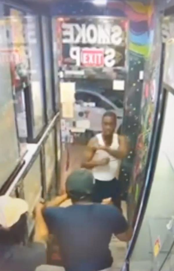 Heart-pounding footage shows the moment a gunman unloaded his weapon on a man who was trying to defend his girlfriend from two creeps inside a Queens co<em></em>nvenience store this week – critically injuring him.