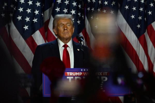 Republican presidential nominee and former U.S. President Do<em></em>nald Trump takes the stage following early results from the 2024 U.S. presidential election in Palm Beach County Co<em></em>nvention Center, in West Palm Beach, Florida, U.S., November 6, 2024