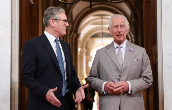 Britain's King Charles III talks with Britain's Prime Minister Keir Starmer (L) during the European Political Community meeting, on July 18, 2024 in Woodstock, England. 