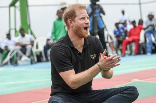 Prince Harry applauds as he takes part in an exhibition sitting volleyball match at Nigeria Unconquered, a local charity organisation that supports wounded, injured, or sick service members, in Abuja on May 11, 2024.