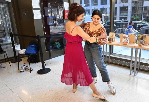 Malena Galletto and her mother, Karlina Romero, dance together during a tango class Romero led on Wednesday afternoon at the Stavros Niarchos Foundation Library in Midtown, Manhattan