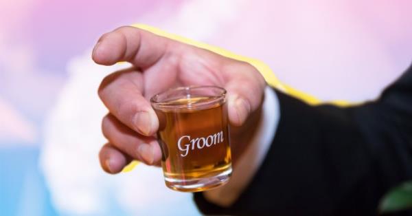 Groom doing a shot 