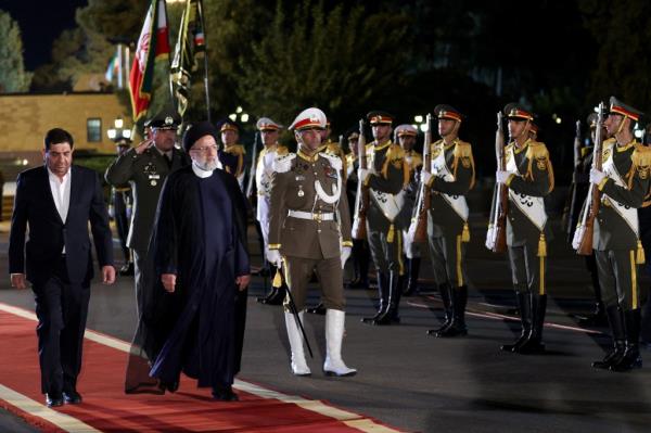 Iranian President Ebrahim Raisi walks during the official farewell ceremony for his trip to New York, at Mehrabad Airport in Tehran, Iran, September 18, 2023. 