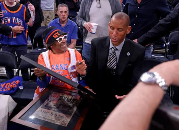 Pacers great Reggie Miller autographs two f<em></em>ramed newspapers for Spike Lee one of them is a New York Post