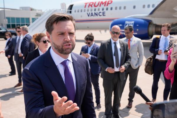 Republican vice presidential nominee Sen. JD Vance speaking to reporters near Air Force Two at Chippewa Valley Regio<em></em>nal Airport, 2024