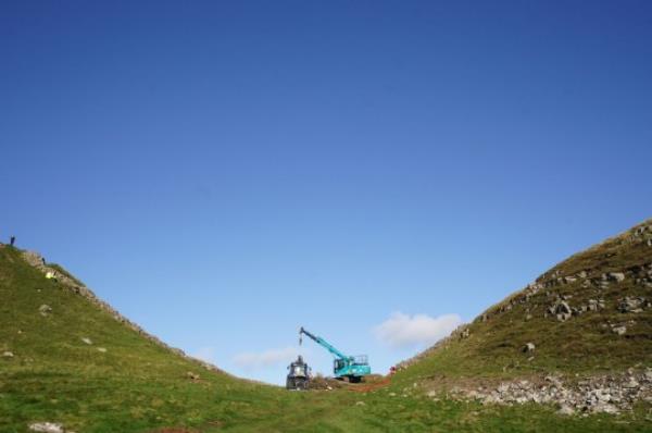 Work begins in the removal of the felled Sycamore Gap tree, on Hadrian's Wall in Northumberland. Picture date: Thursday October 12, 2023. PA Photo. See PA story ENVIRo<em></em>nMENT SycamoreGap. Photo credit should read: Owen Humphreys/PA Wire