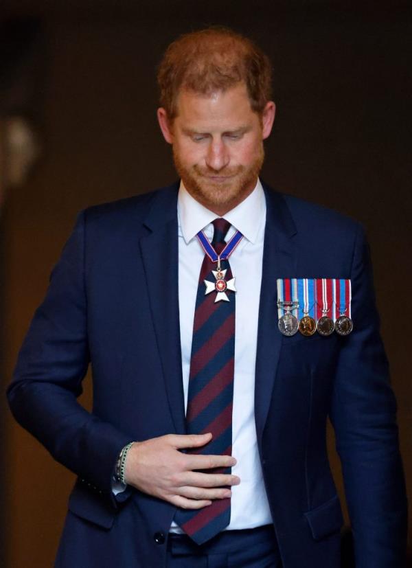 Prince Harry, Duke of Sussex, in a suit with medals on his chest, attending The Invictus Games Foundation 10th Anniversary Service at St Paul's Cathedral in London