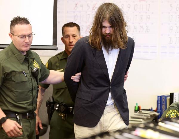 Orange County Deputy Sheriffs escort Samuel Woodward into Orange County Superior Court for opening statements of his murder trial for the stabbing death of Blaze Bernstein on Tuesday, April 9, 2024