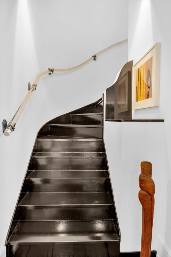 Curved stairs come with the original lucite banister