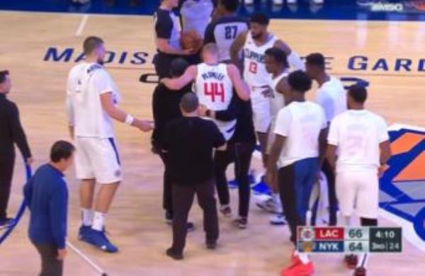 Mason Plumlee is carried off the court after injuring his leg against the Knicks on Monday.