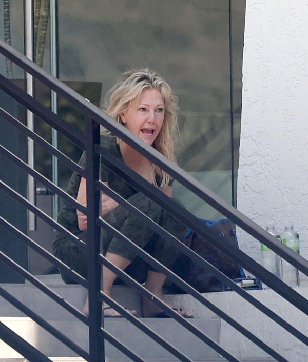 The shocking snaps, taken in Malibu, Calif. on Jun. 29, show the 61-year-old — who has a well-docu<em></em>mented history of struggles with substance abuse and mental health issues —  steadying herself on the ledge of an office building after an undisclosed appointment. 