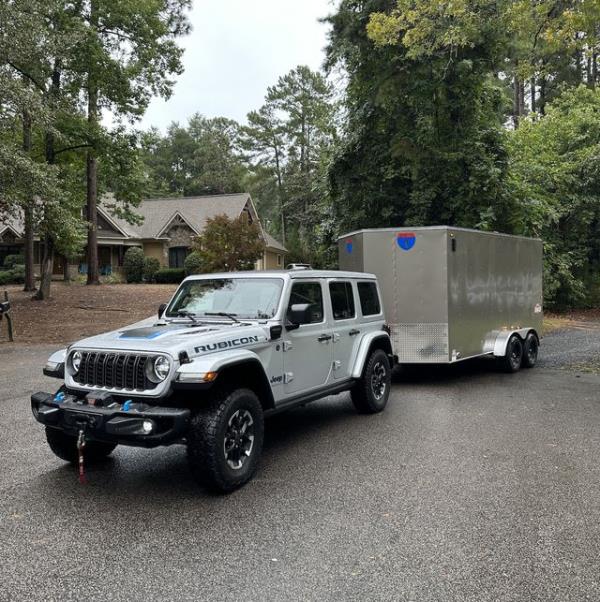 a jeep wrangler with a trailer