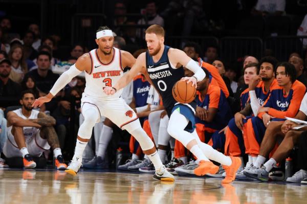 Minnesota Timberwolves guard Do<em></em>nte DiVincenzo is defended by New York Knicks' Josh Hart during the first half of a preseason NBA basketball game, Sunday, Oct. 13, 2024 in New York. 