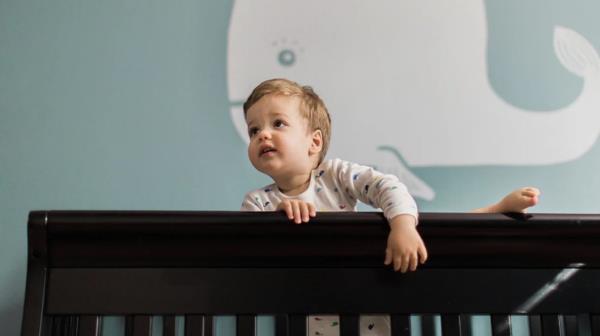 Toddler climbing out of crib