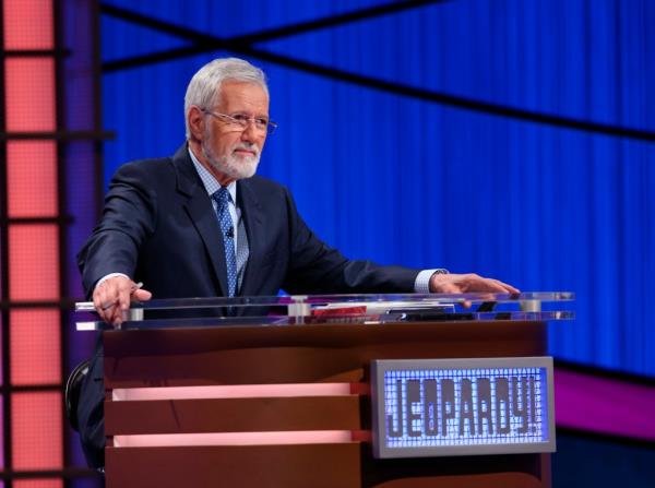 A bearded Alex Trebek hosting 