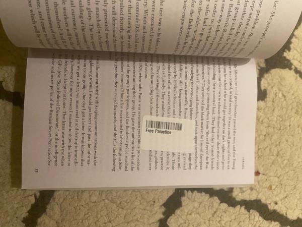 Free Palastine barcode stick covering text in book a<em></em>bout Israel