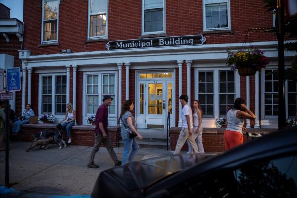 People walk outside the Sag Harbor Village Justice Court on the day pop singer Justin Timberlake was arrested and charged with driving while intoxicated in a neighborhood in the Hamptons.