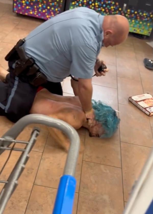 Police holding man on his stomach