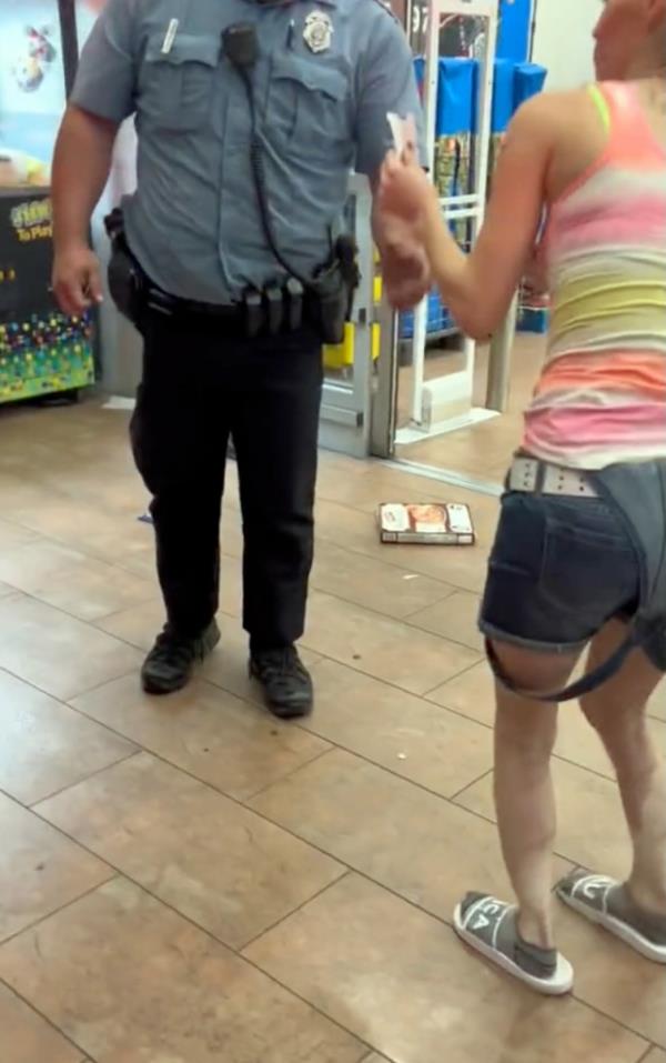 woman hands officer receipt