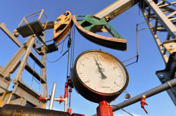 A view shows a pressure gauge near oil pump jacks outside Almetyevsk