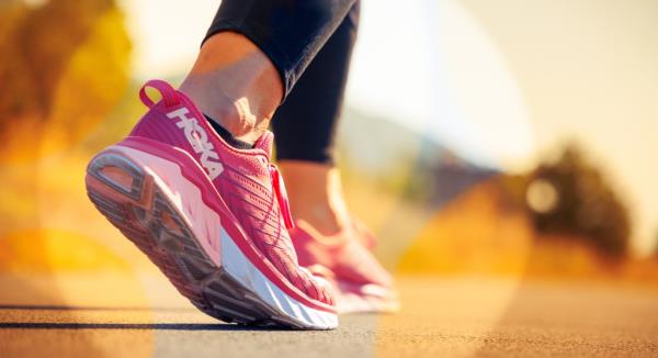 Pink Hoka running shoes.