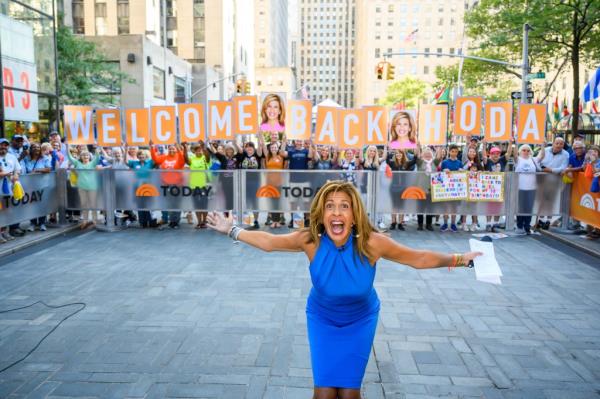 Hoda Kotb in a blue dress with her arms outstretched on the TODAY Show, September 3, 2019