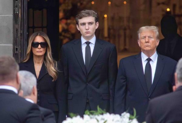 Melania Trump, Barron Trump, and former President Do<em></em>nald Trump, watch as Amalija Knavs' casket is brought into a church.