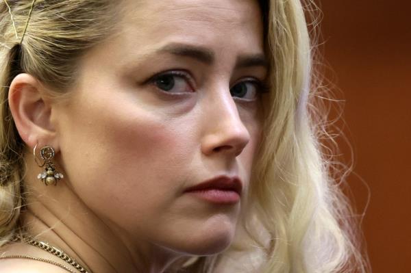 US actress Amber Heard waits before the jury announced a split verdict in favor of both Johnny Depp and Amber Heard on their claim and counter-claim