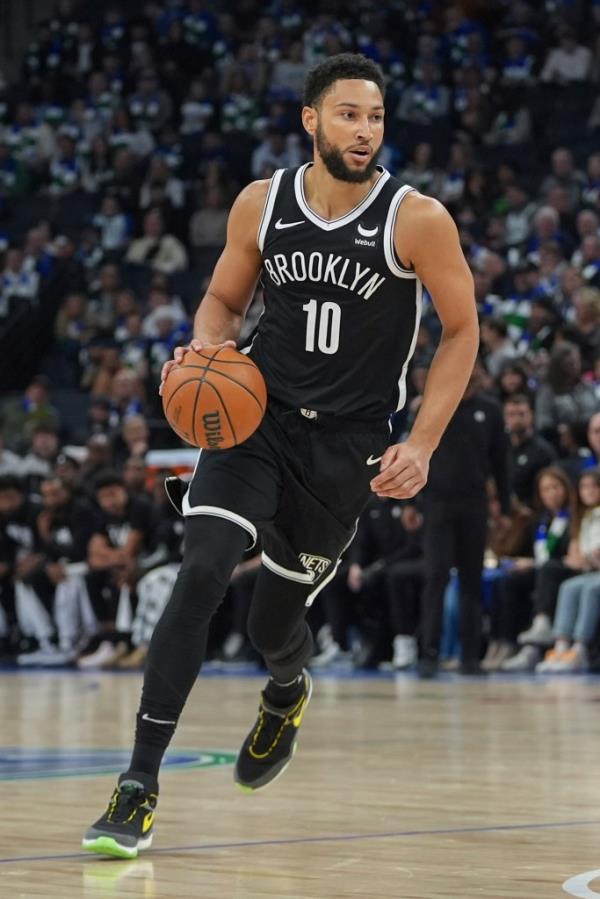 Brooklyn Nets guard Ben Simmons brings the ball up during the first half of the team's NBA basketball game against the Minnesota Timberwolves, Saturday, Feb. 24, 2024, in Minneapolis.  