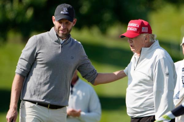 Eric Trump with his Dad golfing