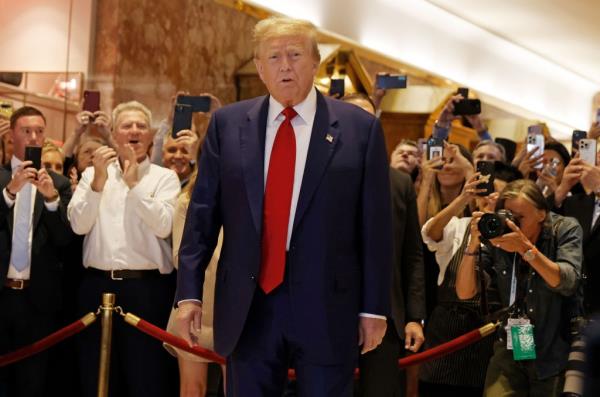 Do<em></em>nald Trump arrives for a press co<em></em>nference at Trump Tower the day after a jury found him guilty on all 34 counts in his hush mo<em></em>ney criminal trial.