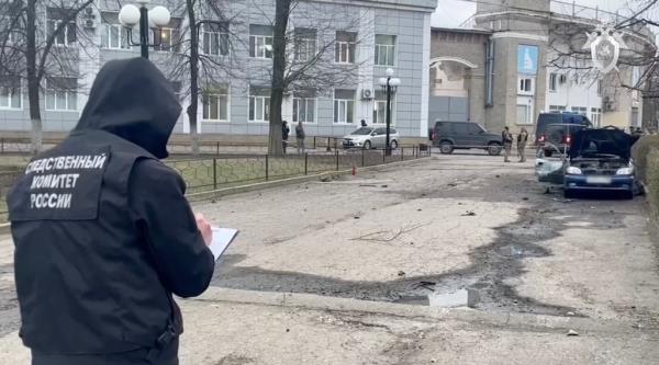 A member of Russia's Investigative Committee is seen at the scene of the car bombing in Luhansk 