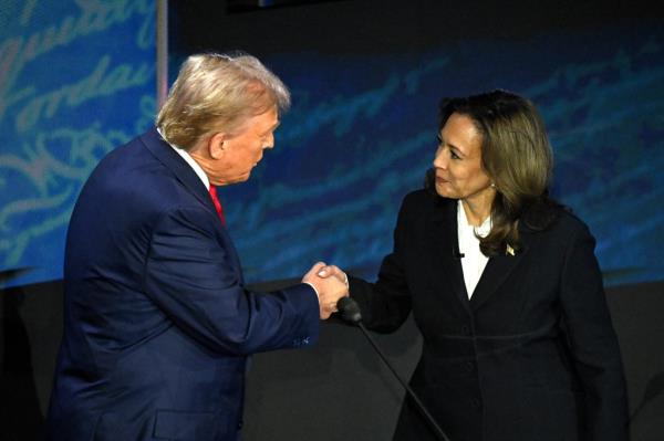 trump shaking harris' hand on the debate stage