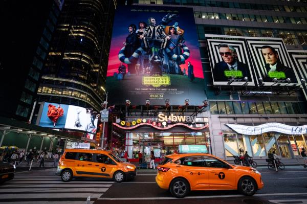 Beetlejuice Beetlejuice billboard illuminated at night in Times Square, New York City, on September 04, 2024