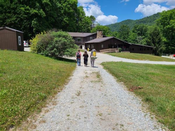 People walk along a trail.