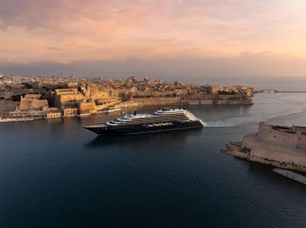 Luxury yacht Ilma sailing in the water, part of the Ritz Carlton Yacht Collection, offering trips around the world.