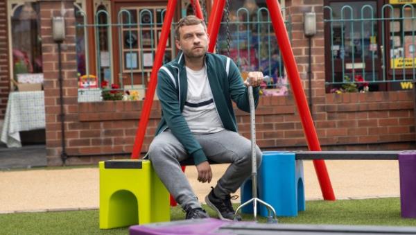 A glum Paul Foreman sits on a bench in the park in Corrie